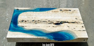 The coffee table has a sculpted drop to show the slopes of the ocean or the lagoon.